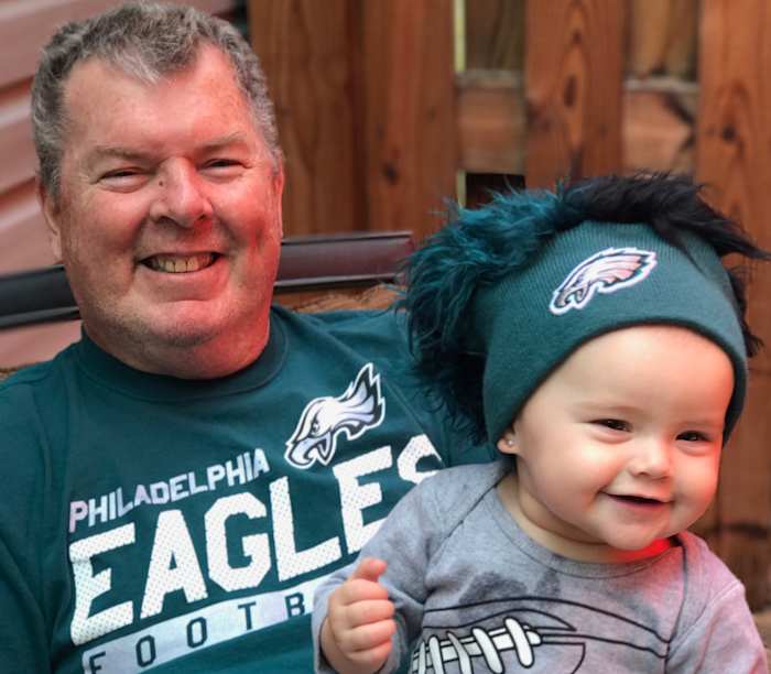Wayne with granddaughter Henley, a budding Eagles fan.